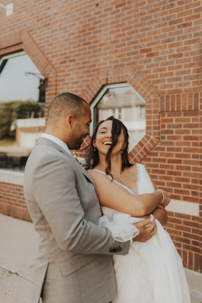 bride and groom taking portraits on their wedding day