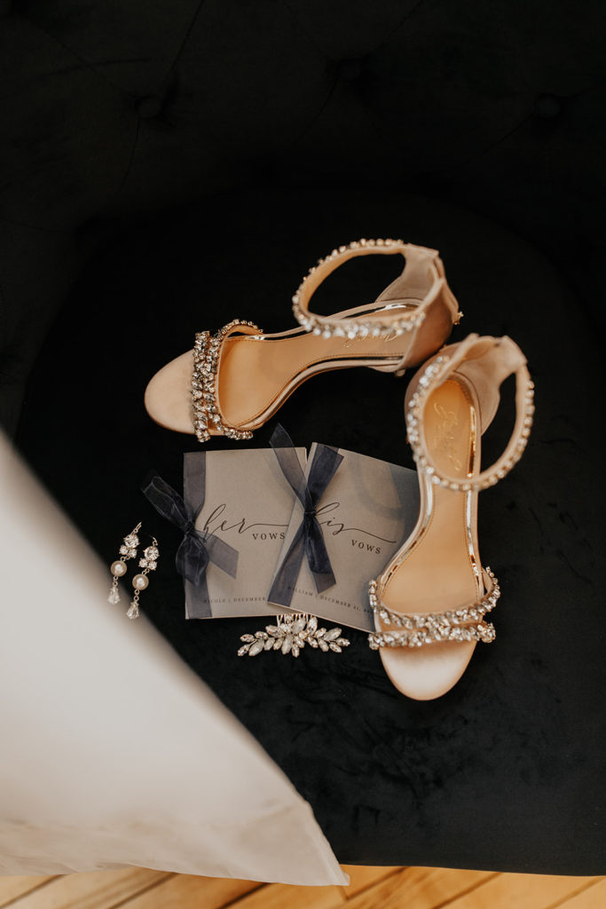 wedding shoes, earrings, and vow books