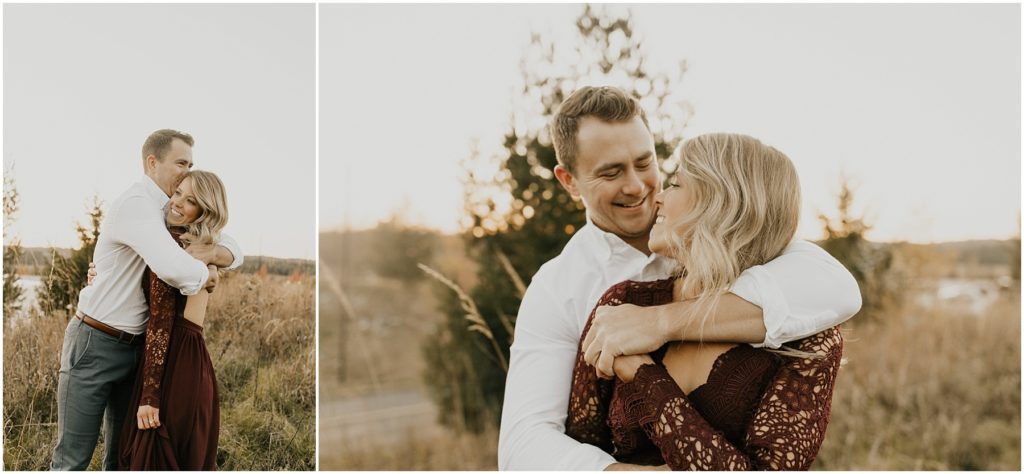 fall engagement session, engaged couple in a meadow holding each other 