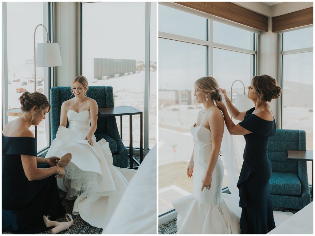bride getting ready and putting on dress on wedding day