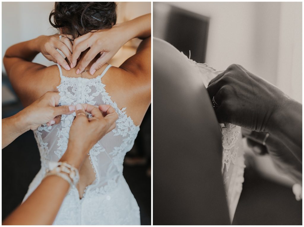 bride putting on her lace wedding dress