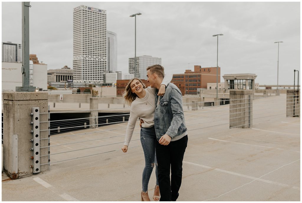 couples engagement session on a city rooftop in wisconsin
