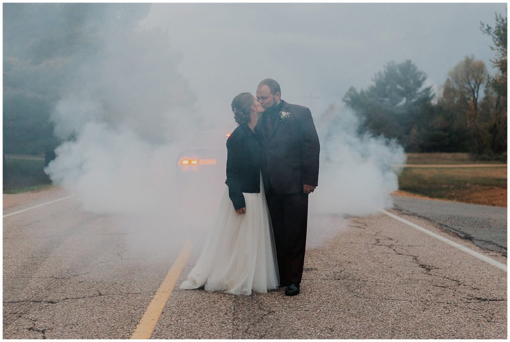 bride and groom photos with a smoke bomb